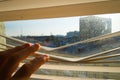 Man watching through plastic blinds windows to the street. Royalty Free Stock Photo