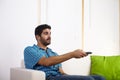 Young man watching television Royalty Free Stock Photo