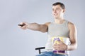 Young man watching television with popcorn