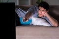 The young man watching tv late at night Royalty Free Stock Photo