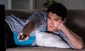 Young man watching tv late at night Royalty Free Stock Photo