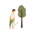 Young man watering apple tree Garden works concept