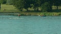 Young Man Waterskiing on the Lake