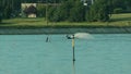 Young Man Waterskiing on the Lake