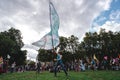 Young man waving giant flag at Extinction Rebellion Protest at Parliament square