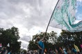 Young man waving giant flag at Extinction Rebellion Protest at Parliament square