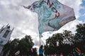 Young man waving giant flag at Extinction Rebellion Protest at Parliament square