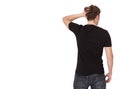Young man wearing blank black t-shirt isolated on white background. Copy space. Place for advertisement. Back view Royalty Free Stock Photo