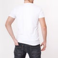 Young man wearing blank t-shirt isolated on white background. Copy space. Place for advertisement. Back view Royalty Free Stock Photo