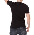 Young man wearing blank t-shirt isolated on white background. Copy space. Place for advertisement. Back view Royalty Free Stock Photo