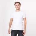 Young man wearing blank white t-shirt isolated on white background. Copy space. Place for advertisement Royalty Free Stock Photo