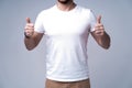 Young man wearing blank white t-shirt isolated on white background. Copy space. Place for advertisement. Front view Royalty Free Stock Photo