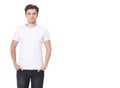 Young man wearing blank white t-shirt isolated on white background. Copy space. Place on tshirt for advertisement Royalty Free Stock Photo