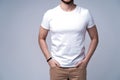 Young man wearing blank white t-shirt isolated on white background. Copy space. Place for advertisement. Front view Royalty Free Stock Photo