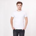 Young man wearing blank white t-shirt isolated on white background. Copy space. Place for advertisement. Mock up Royalty Free Stock Photo
