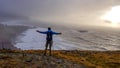 Iceland - Young man standing on a cliff