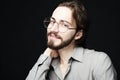 Young man wearing eyeglasses over black background. Lifestyle co Royalty Free Stock Photo