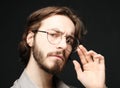 Young man wearing eyeglasses over black background. Lifestyle concept.Close up. Royalty Free Stock Photo