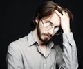 Young man wearing eyeglasses over black background. Lifestyle co Royalty Free Stock Photo