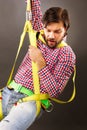 Young man wearing a fall protection harness and lanyard for wor Royalty Free Stock Photo