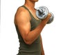 A young man wearing a green vest lifting a dumbbell isolated on white background