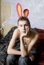 young man wearing hare ear at old wall Royalty Free Stock Photo