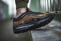 Young man wearing a pair of Nike Air Max 97 Premium Camo Pack Italy