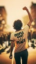 A young man wearing a \'People Want Peace\' AI-generated T-shirt