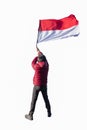 Young man wearing red coat with holding flag indonesia national Royalty Free Stock Photo