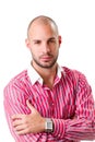 Young man wearing red striped shirt and looking at camera Royalty Free Stock Photo