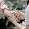 A young man is wearing a ring to a woman on Valentine`s Day to express his love and to request a woman to marry. The idea of