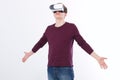 Young man wearing virtual reality goggles isolated on white background. Digital VR glasses for 360 game. Template and blank shirt. Royalty Free Stock Photo