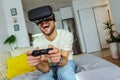 Man wearing virtual reality goggles in the living room and play video game Royalty Free Stock Photo