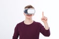 Young Man wearing virtual reality goggles and toch space by finger isolated on white background. VR concept and copy space. Select