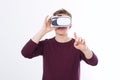 Young Man wearing virtual reality goggles and toch space by finger isolated on white background. VR concept and copy space. Royalty Free Stock Photo