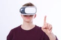 Young Man wearing virtual reality goggles and toch space by finger isolated on white background. VR concept and copy space. Select