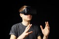 Young Man Wearing Virtual Reality Headset In Studio Royalty Free Stock Photo