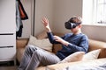 Young Man Wearing Virtual Reality Headset In Studio Royalty Free Stock Photo