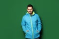 Young man wearing warm clothes on color background Royalty Free Stock Photo