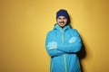 Young man wearing warm clothes on color background Royalty Free Stock Photo