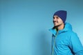 Young man wearing warm clothes on color background Royalty Free Stock Photo