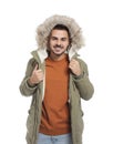 Young man wearing warm clothes on white. Ready for winter vacation Royalty Free Stock Photo