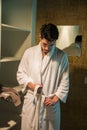 Young man wearing white bathrobe in spa Royalty Free Stock Photo