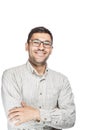 Young man wearing white checkered shirt and glasses standing with crossed arms and smiling. Royalty Free Stock Photo