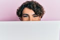 Young man wearing woman make up holding cardboard banner with blank space covering half face smiling with a happy and cool smile Royalty Free Stock Photo