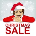 Young man wearnig santa hat leaned on blank board with red christmas sale text