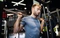 Man with weight training equipment exercising in sport gym club Royalty Free Stock Photo