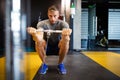 Man with weight training equipment exercising in sport gym club Royalty Free Stock Photo