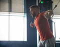 Young man with weight training in gym equipment in sport club