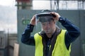 Young man welder with Down syndrome working in industrial factory, social integration concept. Royalty Free Stock Photo